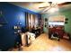 Bedroom showcasing tile floors, a ceiling fan, and personal items in need of organizing at 1431 Ne 53Rd St, Ocala, FL 34479