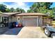 Detached garage with large roll-up door, offering convenient parking and storage options at 1431 Ne 53Rd St, Ocala, FL 34479