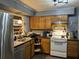 Efficient kitchen featuring wood cabinets and stainless steel appliances at 1431 Ne 53Rd St, Ocala, FL 34479