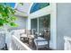 Cozy balcony with seating area, perfect for relaxing and enjoying the view with a glass window at 16538 Rockwell Heights Ln, Clermont, FL 34711