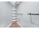 An open closet features custom organizers and shelving at 16538 Rockwell Heights Ln, Clermont, FL 34711