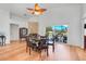 Formal dining room with a large window, a stone fireplace, and comfortable seating at 16538 Rockwell Heights Ln, Clermont, FL 34711