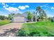 Lovely single-Gathering home with a brick driveway, two-car garage, and neatly landscaped yard at 16538 Rockwell Heights Ln, Clermont, FL 34711