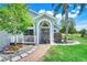 Inviting front entrance with a beautiful door and manicured landscaping along the walkway at 16538 Rockwell Heights Ln, Clermont, FL 34711