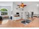 Kitchen with stainless steel appliances, ample counter space, and a view to the outside and hardwood floors at 16538 Rockwell Heights Ln, Clermont, FL 34711