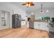 Bright kitchen with stainless steel appliances and ample counter space and hardwood floors at 16538 Rockwell Heights Ln, Clermont, FL 34711