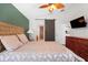 A Primary bedroom features wood floors and access to the Primary bathroom at 16538 Rockwell Heights Ln, Clermont, FL 34711