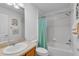 Bathroom with shower-tub combo, single sink, and decorative elements at 1743 Landrum Ln, The Villages, FL 32162