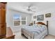 Bedroom with a ceiling fan, double bed, and window at 1743 Landrum Ln, The Villages, FL 32162