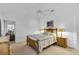 A bedroom with a double bed, ceiling fan, and two bedside tables at 1743 Landrum Ln, The Villages, FL 32162
