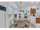 Cozy breakfast nook with ample lighting perfect for morning gatherings at 1743 Landrum Ln, The Villages, FL 32162