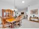 Open-concept dining area flows into living room, great for entertaining at 1743 Landrum Ln, The Villages, FL 32162