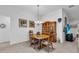 Traditional dining room with a wood table, hutch, and chandelier at 1743 Landrum Ln, The Villages, FL 32162