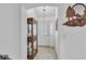 Welcoming entryway with neutral tile floors and an arched doorway to the main living area at 1743 Landrum Ln, The Villages, FL 32162