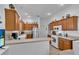 A kitchen with stainless steel appliances and wooden cabinetry at 1743 Landrum Ln, The Villages, FL 32162