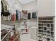 Spacious walk-in closet with organized shelving and ample storage space at 17930 Se 87Th Bourne Ave, The Villages, FL 32162