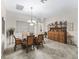 Formal dining room featuring elegant lighting and decor, perfect for intimate gatherings and entertaining guests at 17930 Se 87Th Bourne Ave, The Villages, FL 32162