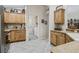 A bright kitchen with wooden cabinets, stainless steel appliances, and tile floors at 17930 Se 87Th Bourne Ave, The Villages, FL 32162