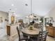 Open floor plan view featuring kitchen with bar seating and spacious living area at 17930 Se 87Th Bourne Ave, The Villages, FL 32162
