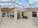 Enclosed patio features dining area, sitting area, and ample space at 17930 Se 87Th Bourne Ave, The Villages, FL 32162