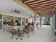 Covered patio with comfortable seating and view into living room at 17930 Se 87Th Bourne Ave, The Villages, FL 32162