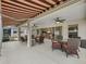 Enclosed patio with dining area, seating area, and view into home at 17930 Se 87Th Bourne Ave, The Villages, FL 32162