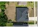 High aerial view of home with expansive backyard and dark colored roof at 1922 Angel Fish Loop, Leesburg, FL 34748