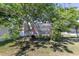 Backyard featuring a treehouse with wooden ladder for outdoor enjoyment at 1922 Angel Fish Loop, Leesburg, FL 34748