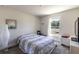 Bright bedroom with a bed, a window, and ample space at 1922 Angel Fish Loop, Leesburg, FL 34748