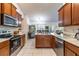 Bright kitchen with stainless steel appliances and granite countertops at 1922 Angel Fish Loop, Leesburg, FL 34748