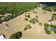 Aerial view of a sprawling land area with lush trees and structures at 19726 Mccall Rd, Altoona, FL 32702