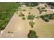 Extensive acreage showcasing a spacious lot with scattered trees, outbuildings, and a private setting at 19726 Mccall Rd, Altoona, FL 32702