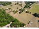 Expansive aerial view of a green landscape with scattered homes and trees at 19726 Mccall Rd, Altoona, FL 32702