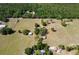 Aerial view of a vast land area with lush trees and structures at 19726 Mccall Rd, Altoona, FL 32702