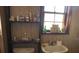Small bathroom featuring a pedestal sink and compact toilet at 19726 Mccall Rd, Altoona, FL 32702