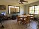 Dining room featuring wood floors, lots of sunlight, and neutral paint at 19726 Mccall Rd, Altoona, FL 32702