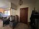 Entryway features decorative front door, tile flooring, and partial view of the living space at 19726 Mccall Rd, Altoona, FL 32702
