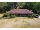 Aerial view of a single-story brick home with a brown roof and spacious backyard at 19726 Mccall Rd, Altoona, FL 32702