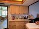 Kitchen space with wood cabinets and view into the breakfast nook at 19726 Mccall Rd, Altoona, FL 32702