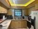 Kitchen features wooden cabinets, laminate countertops, and a stainless steel sink at 19726 Mccall Rd, Altoona, FL 32702