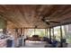 Enclosed porch with brick accents and ceiling fans offers comfortable outdoor living at 19726 Mccall Rd, Altoona, FL 32702