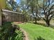 Spacious backyard features a screened-in lanai and picturesque views of the pond and mature trees at 2010 Otters Pond Rd, Fruitland Park, FL 34731