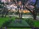 Inviting backyard patio area with outdoor seating and views of the pond at 2010 Otters Pond Rd, Fruitland Park, FL 34731