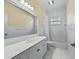 Bathroom with white cabinets and tile floor at 2010 Otters Pond Rd, Fruitland Park, FL 34731