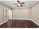 Neutral bedroom offers hardwood floors, recessed lighting, and bright white trim at 2010 Otters Pond Rd, Fruitland Park, FL 34731