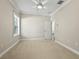 Spacious bedroom with carpet, window, and ceiling fan at 2010 Otters Pond Rd, Fruitland Park, FL 34731