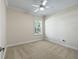 Bright bedroom with neutral walls, carpet, window, and ceiling fan at 2010 Otters Pond Rd, Fruitland Park, FL 34731