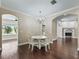Formal dining room features a chandelier and hardwood flooring at 2010 Otters Pond Rd, Fruitland Park, FL 34731