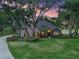 Stunning home with mature trees, lush lawn, beautiful landscaping and stone accents at 2010 Otters Pond Rd, Fruitland Park, FL 34731