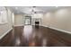 Hardwood floors lead to a fireplace and screened-in patio in this inviting living space at 2010 Otters Pond Rd, Fruitland Park, FL 34731